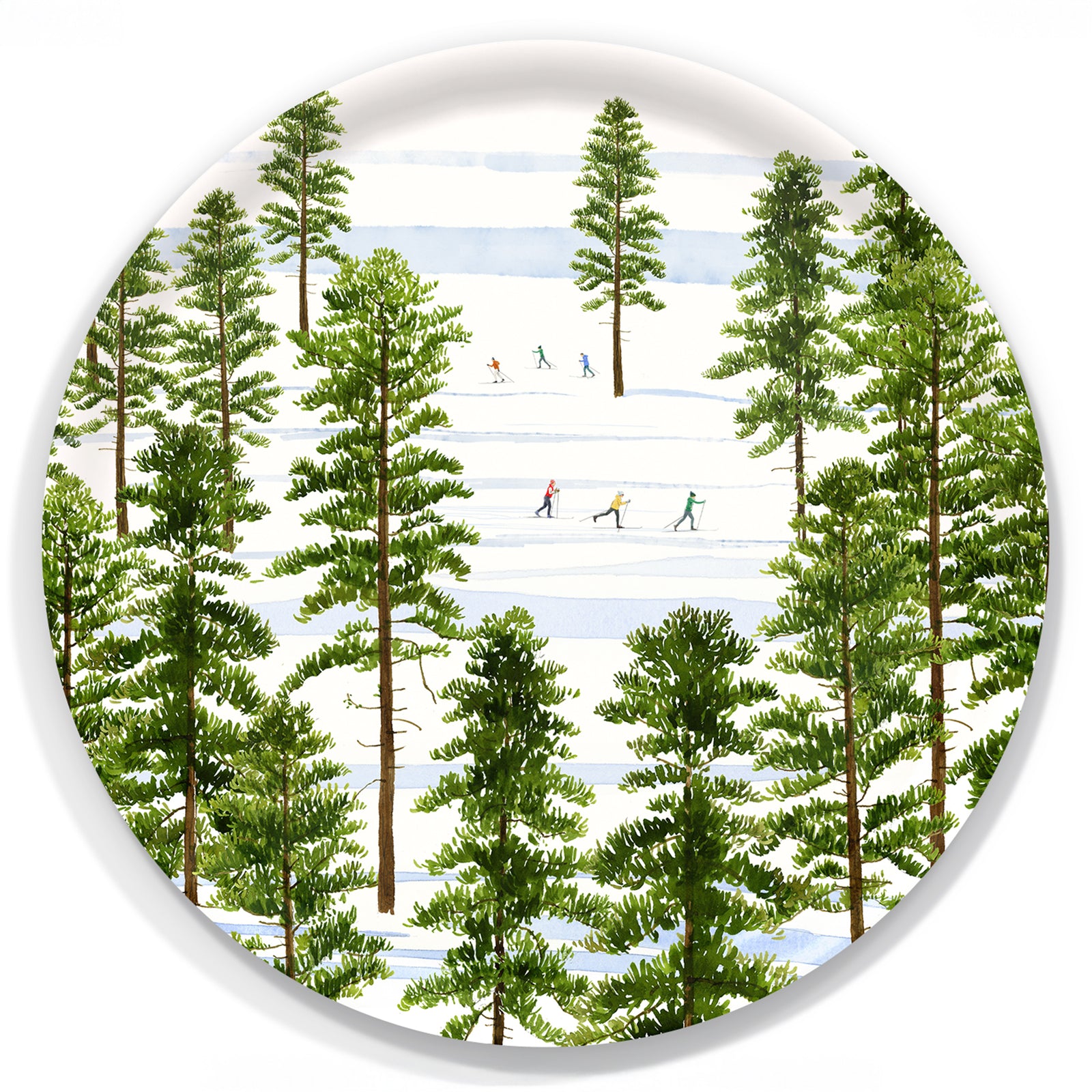 An overhead view of snowy evergreens and cross-country skiers inspires the Caskata X Felix Doolittle Winter Skiers Large Round Tray by Caskata, crafted from FSC-certified birchwood in Finland.