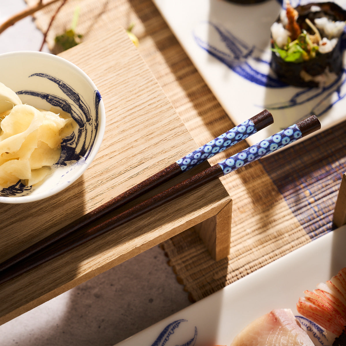 Japanese sushi and Yokohama Chopsticks on a wooden table in Japan by Miya, Inc.