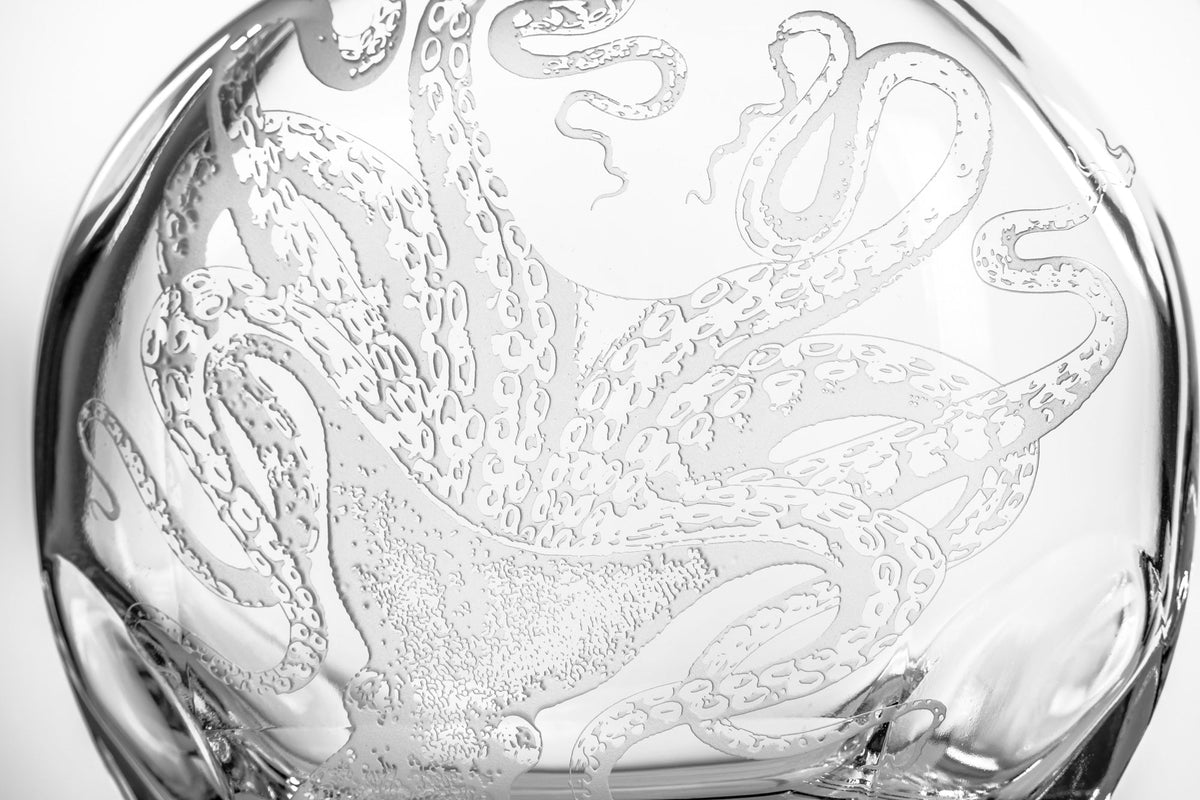 Lucy the octopus is sand-etched on a Lucy Decanter glass vase from Caskata Artisanal Home.