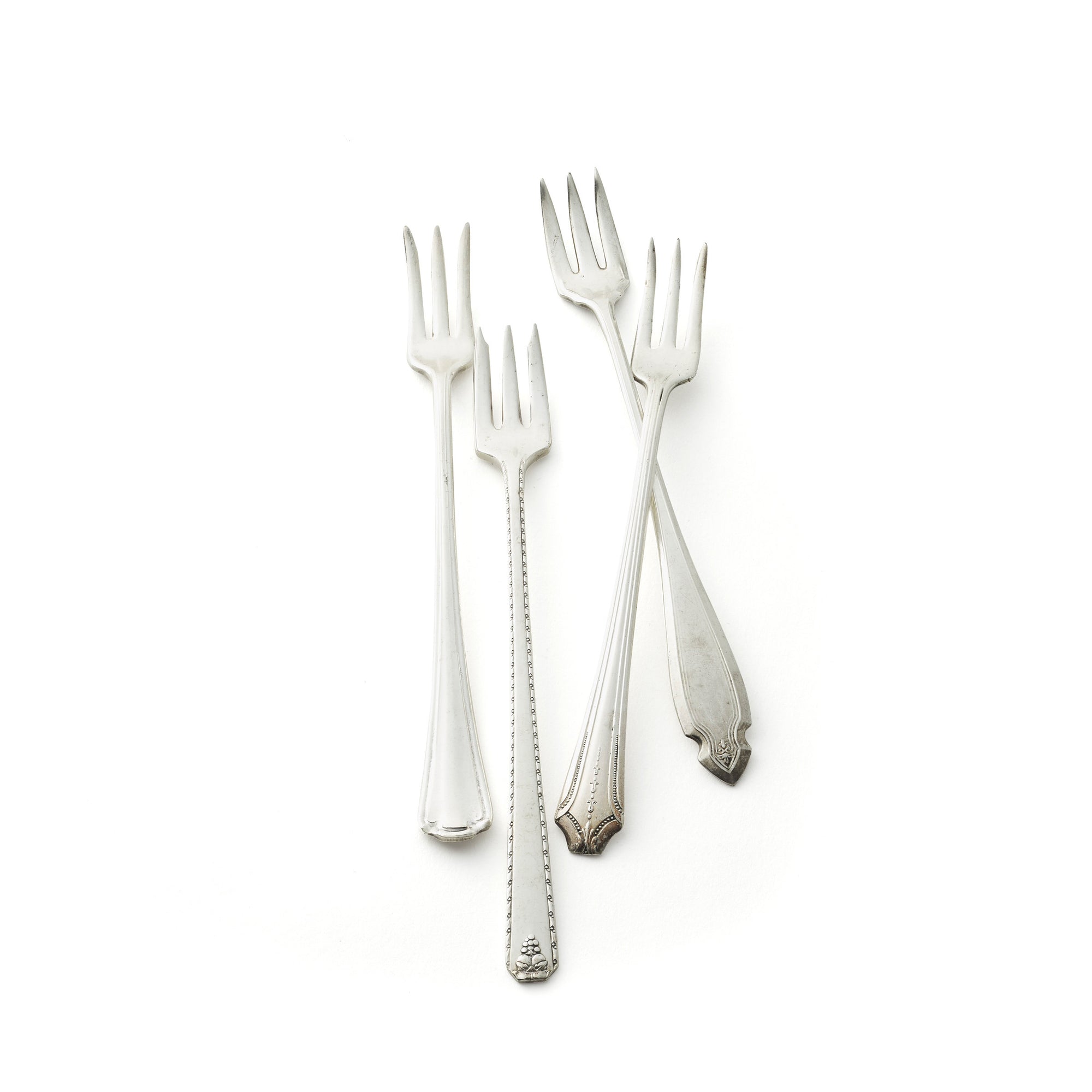 Vintage, silver-plated cocktail forks collected and restored by Caskata.