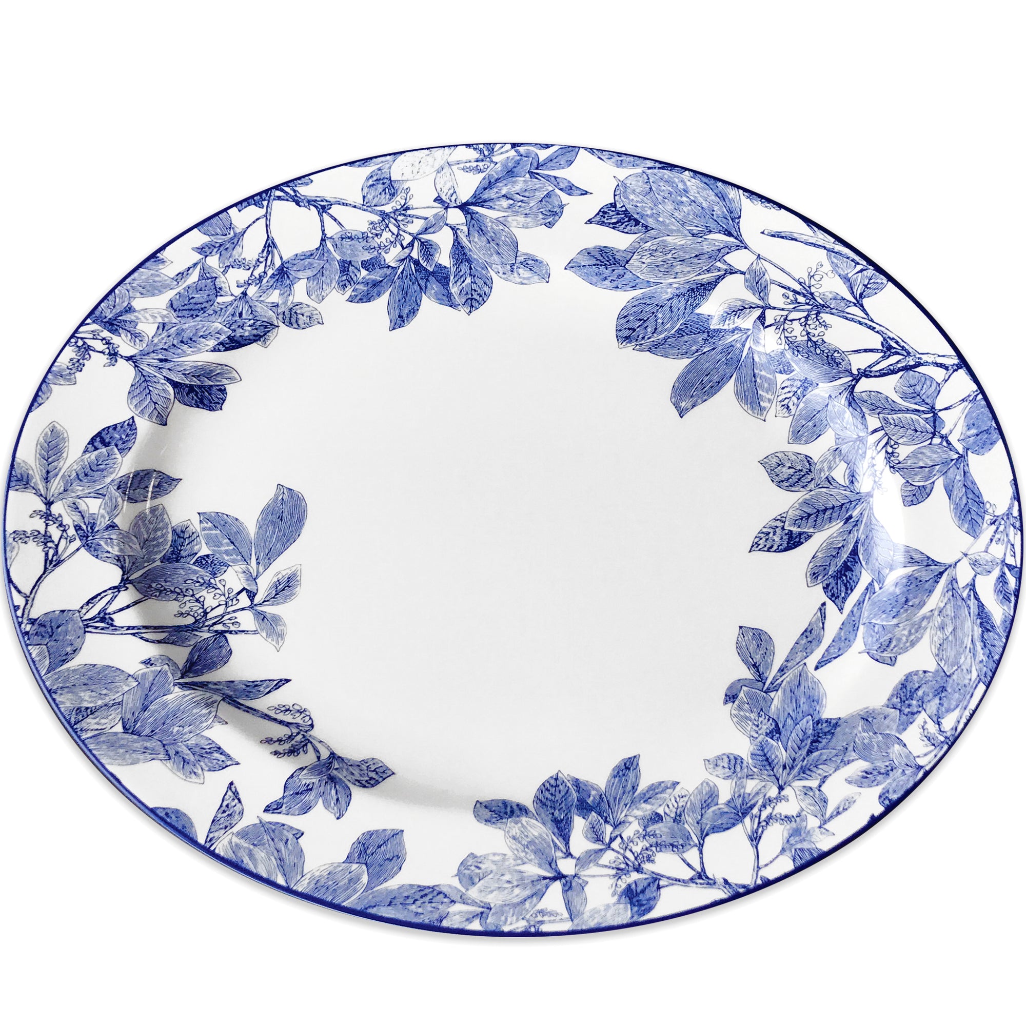 A high-style, white porcelain platter with a blue floral pattern around the rim, the Arbor Oval Rimmed Platter by Caskata Artisanal Home.