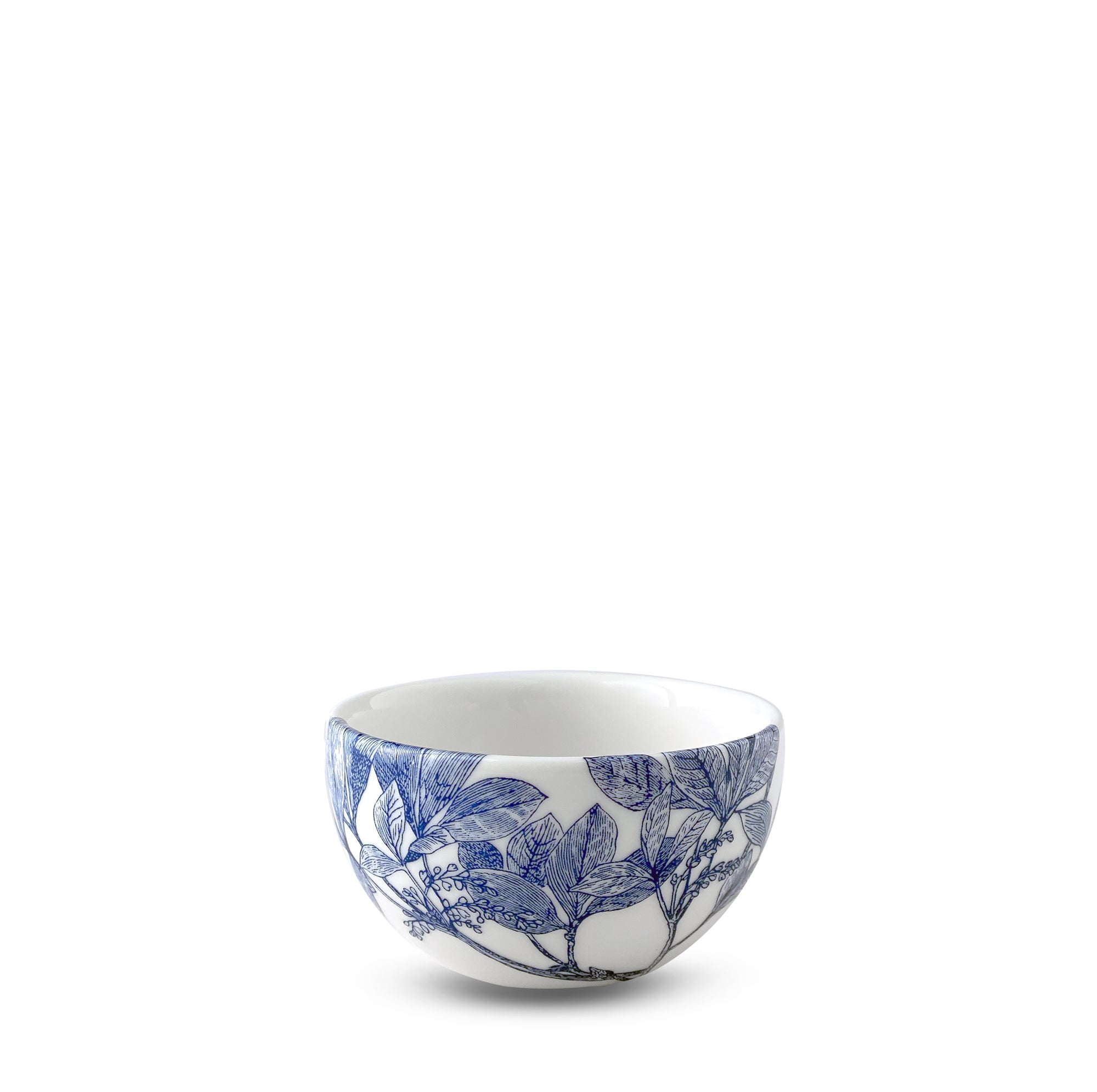 A small porcelain bowl adorned with blue floral and leafy branch patterns on a white background, both dishwasher and microwave safe. The Arbor Snack Bowl by Caskata Artisanal Home.