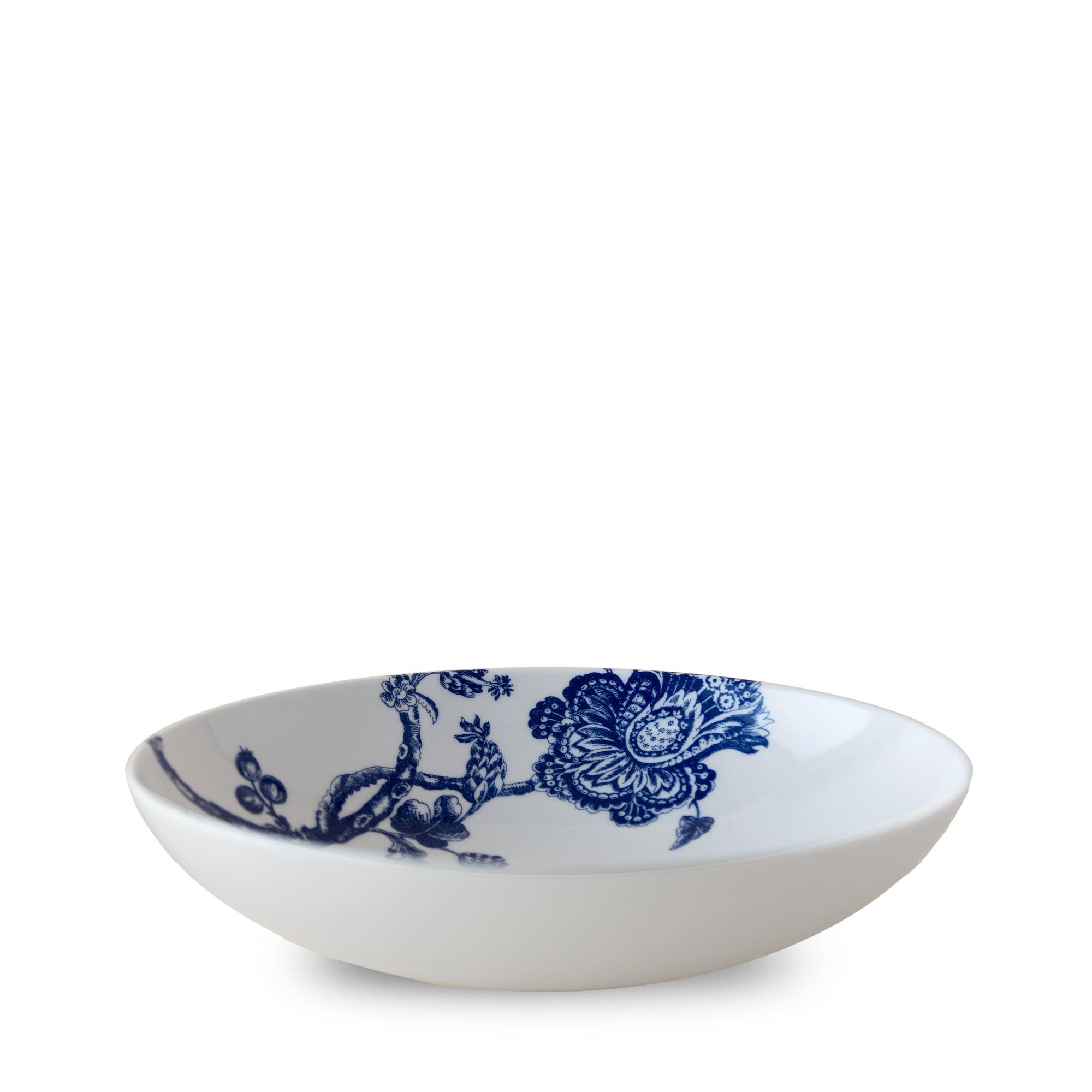 A generous white ceramic bowl with blue floral patterns on the inside, against a plain white background, showcasing the elegance of premium porcelain dinnerware inspired by the Williamsburg Foundation, the Arcadia Entrée Bowl by Caskata Artisanal Home.