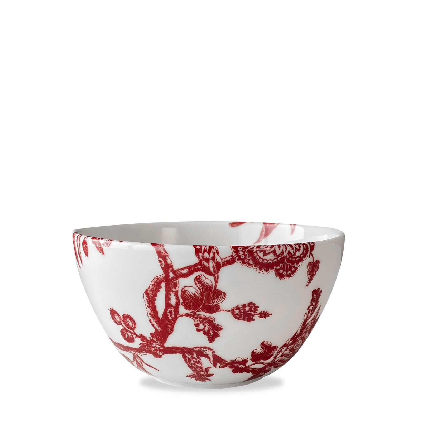 A premium porcelain dinnerware piece, this white cereal bowl features a stunning red floral and bird pattern design, inspired by the Williamsburg Foundation. Introducing the Arcadia Crimson Cereal Bowl by Caskata.