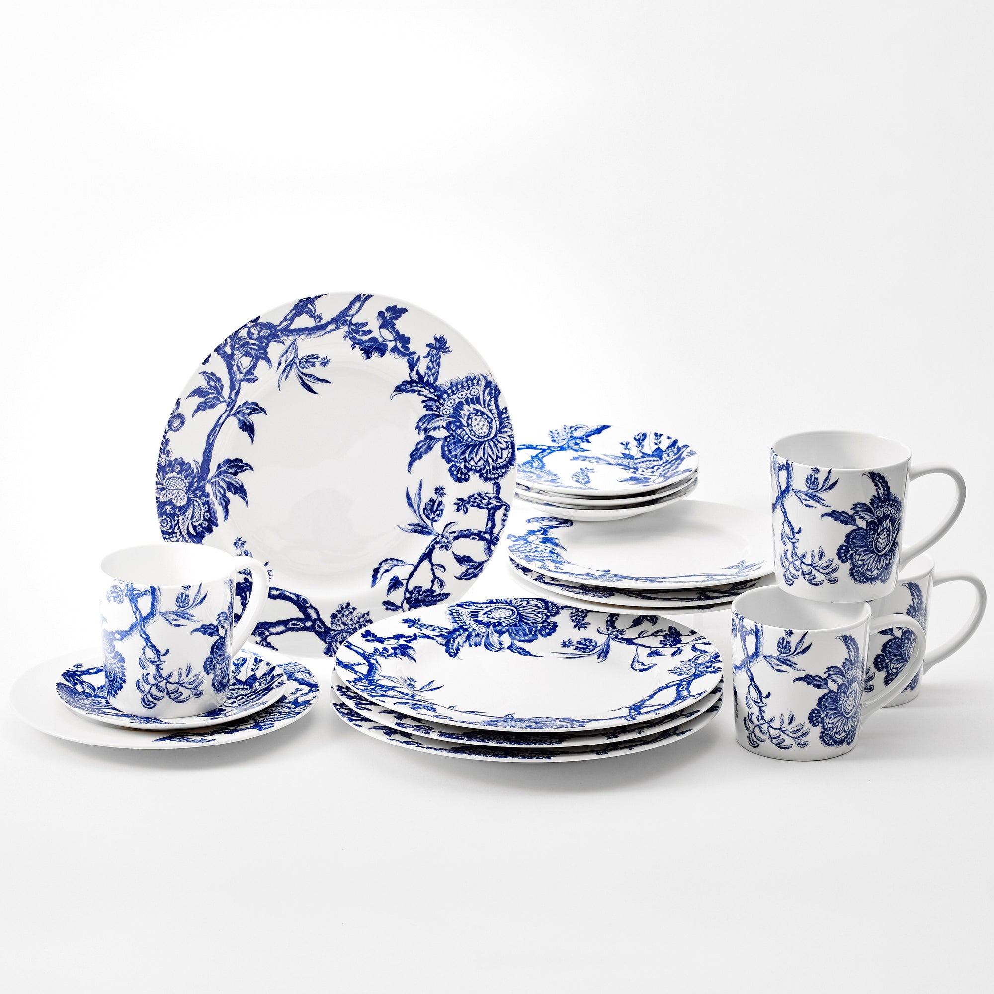 Arcadia Blue 16 piece dinnerware set. Table for four includs 4 dinner plates, 4 salad plates, 4 canape plates, and four mugs, in high-fired porcelain from Caskata. Dishwasher and Microwave Safe.