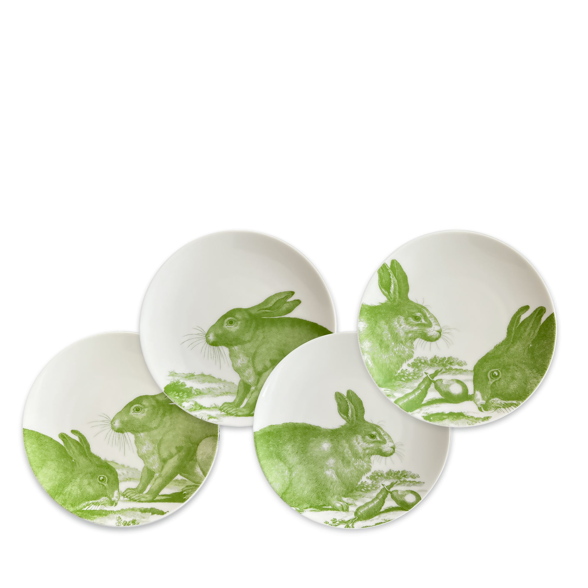 Four white canapé plates feature green illustrations of rabbits in various poses, creating a charming bunny scene. These **Bunnies Verde Small Plates** by **Caskata** make for a delightful addition to any table setting.