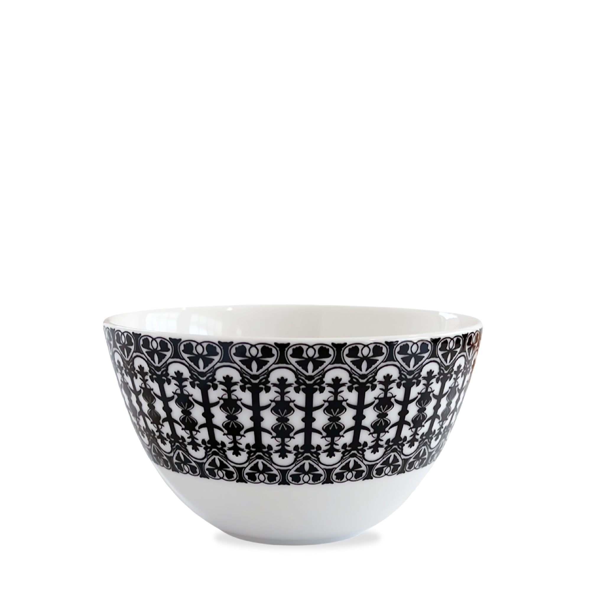 A white ceramic Casablanca Cereal Bowl with intricate black decorative patterns around the exterior, part of the Caskata Artisanal Home dinnerware collection.