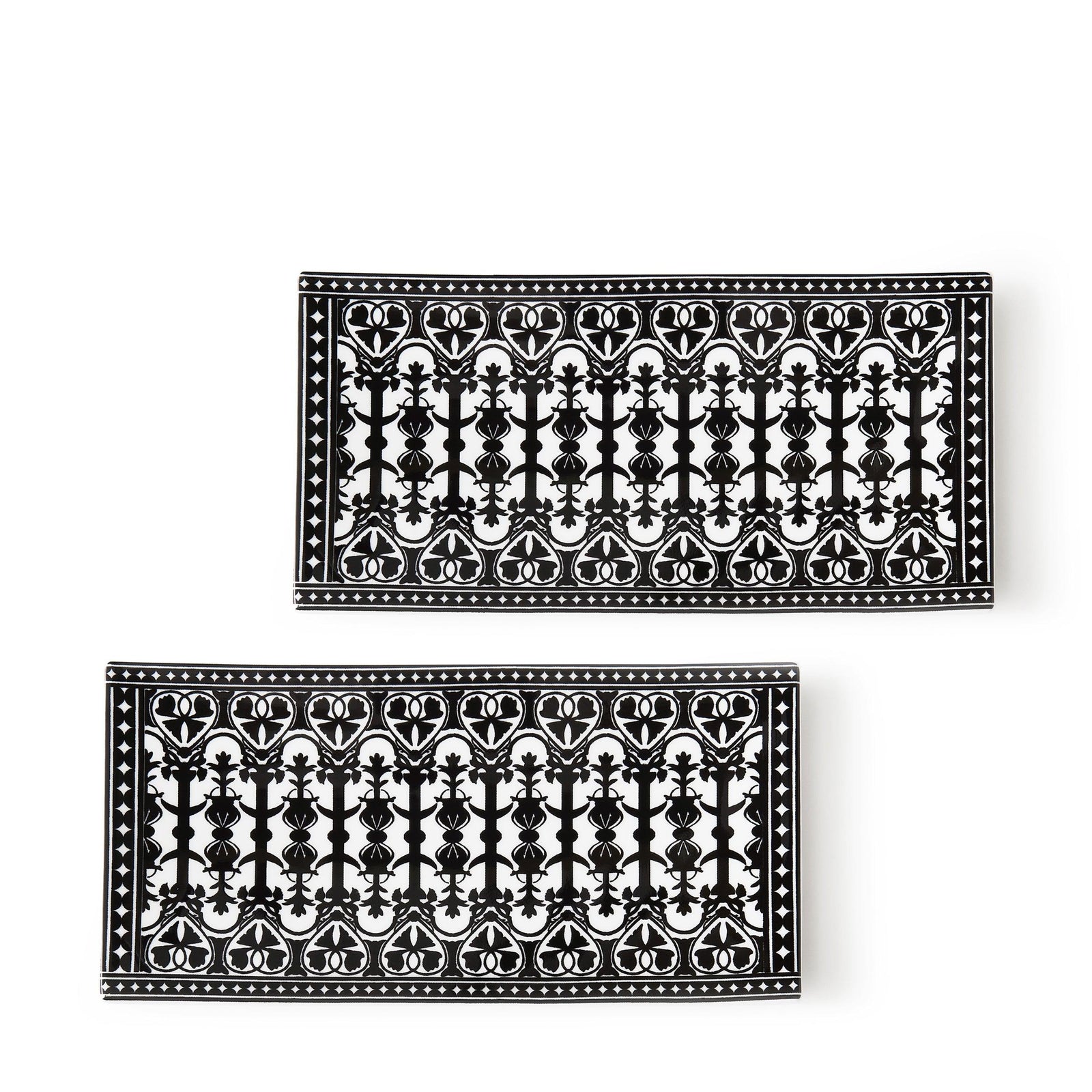 The Caskata Casablanca Petite Trays, Set of 2, feature intricate floral and geometric patterns on bone china, displayed side by side against a white background to highlight their modern shape.