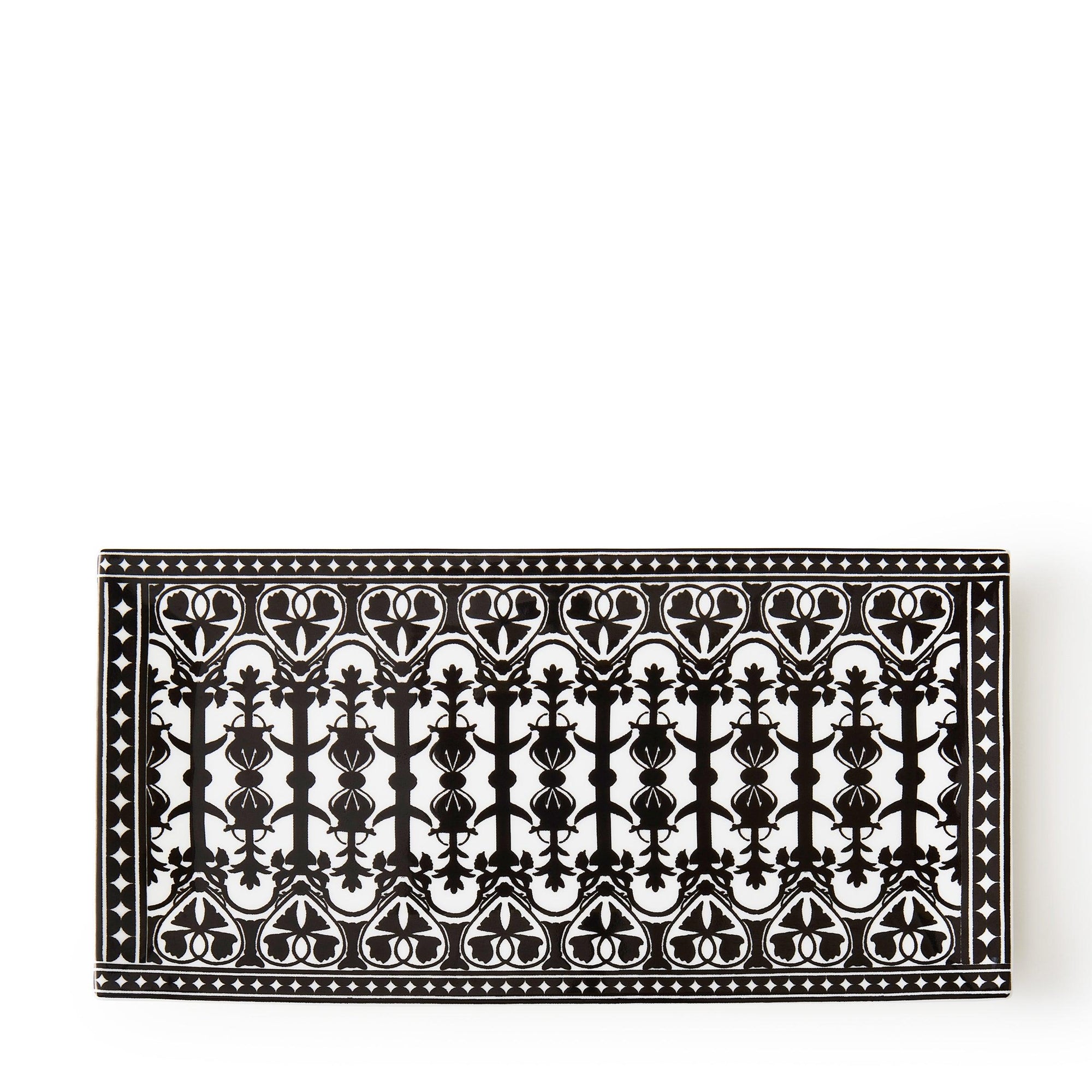 The Casablanca Petite Serving Tray by Caskata is a rectangular tray featuring intricate floral and geometric patterns in black on a crisp white background, capturing the charm of hand-decorated designs.