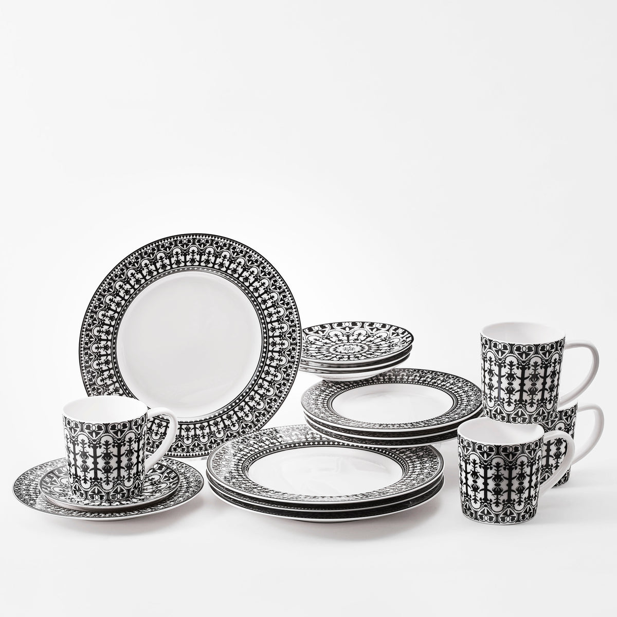 Casablanca Black and White 16 Piece dinnerware set in porcelain from Caskata sets a table for 4.