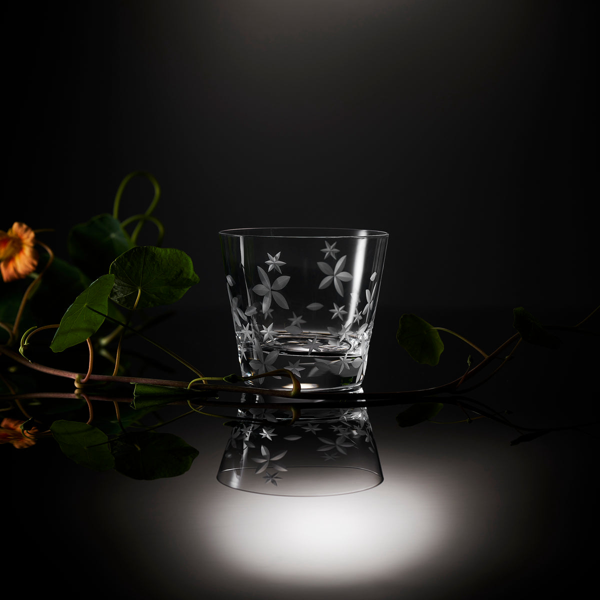 Chatham Bloom Tumbler by Caskata; a lead-free crystal rocks glass etched with a floral design.
