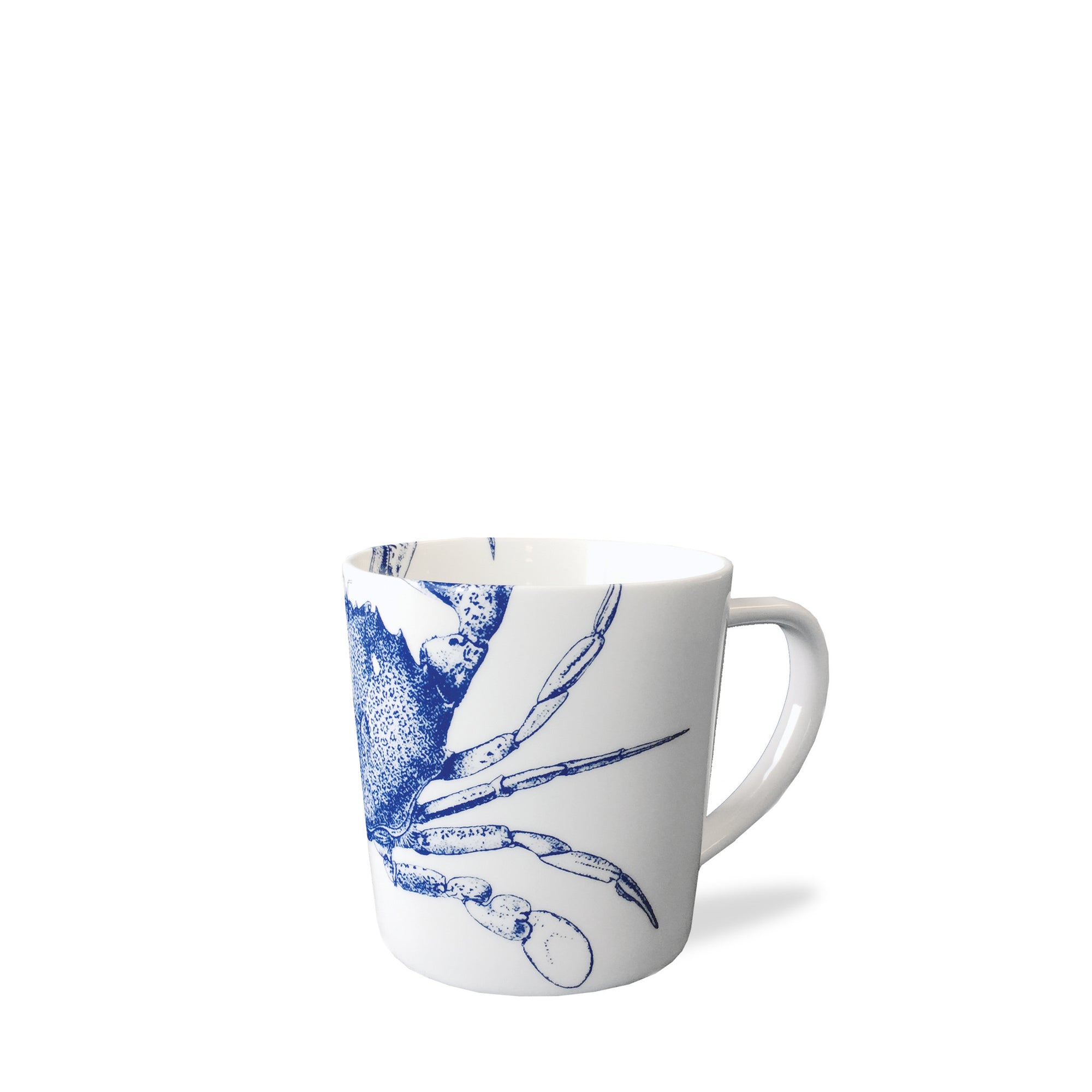 Crab Mug featuring a blue crab illustration, made from high-fired porcelain and placed against a plain white background. This dishwasher safe mug from Caskata Artisanal Home is perfect for adding a touch of coastal charm to any kitchen.