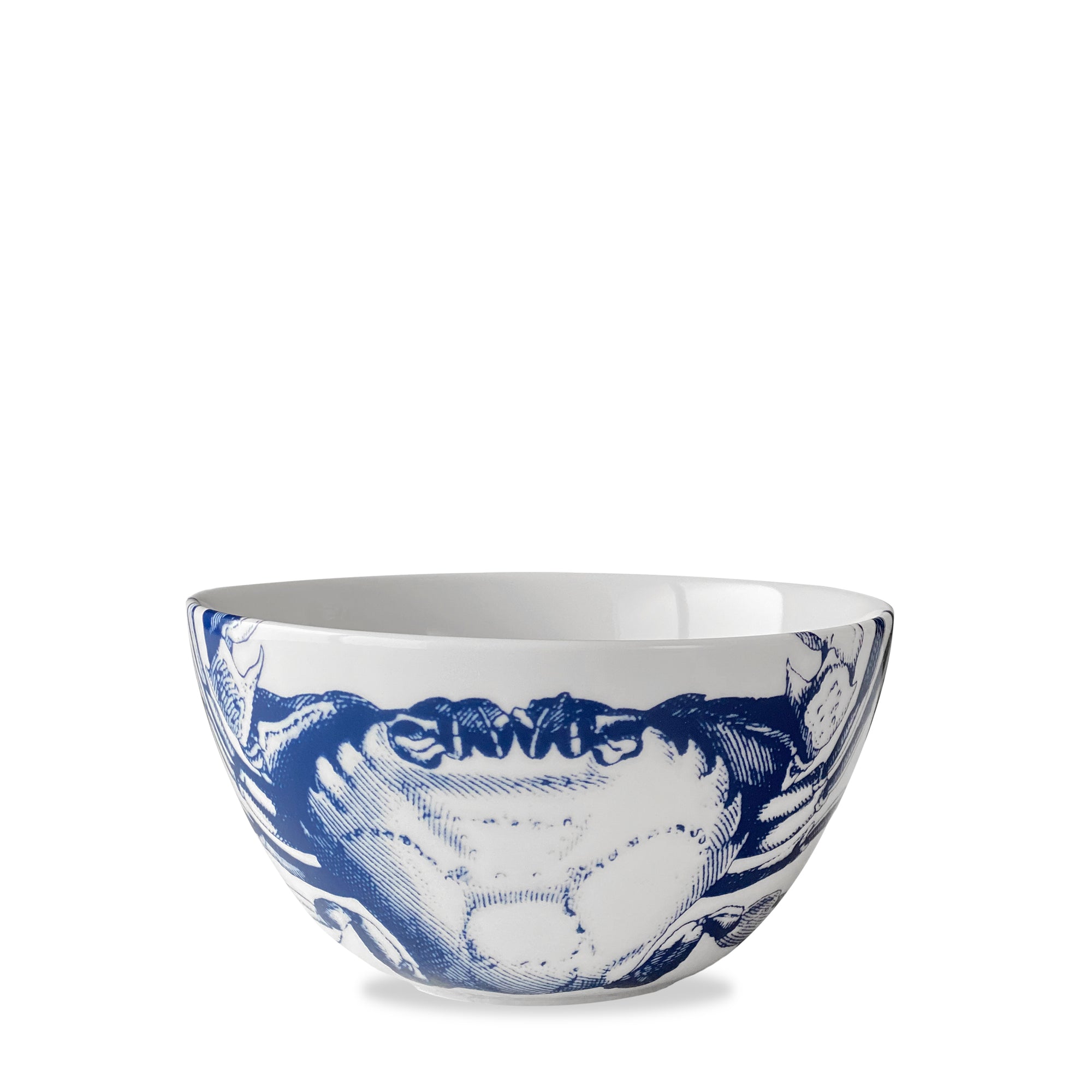 The Caskata Crab Cereal Bowl features a white ceramic base with intricate blue detailing, showcasing an elegant crabs pattern on the exterior.