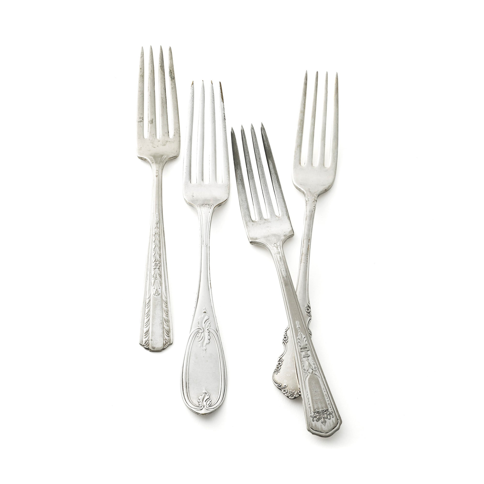 Vintage, silver-plated dinner forks collected by Caskata.