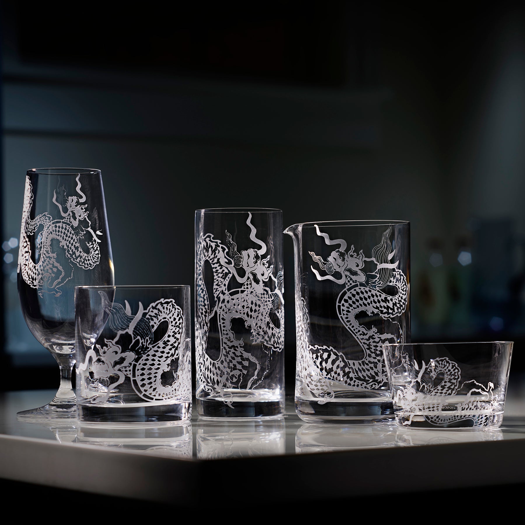 The Dragon collection by Caskata includes a sand-etched crystal tidbit bowl and matching beer, short, tall, and mixing glasses.