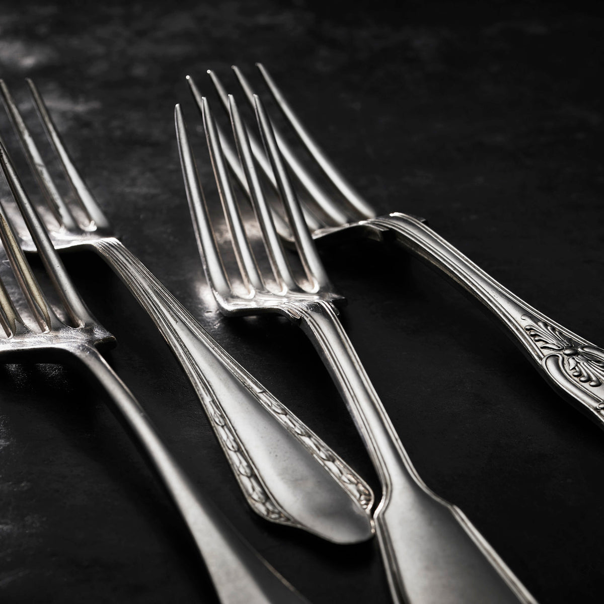 Vintage, silver-plated dinner forks collected by Caskata.