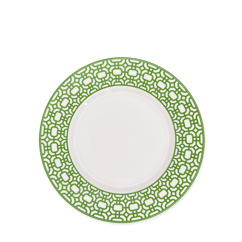 A Newport Garden Gate Verde Rimmed Salad Plate by Caskata Artisanal Home, featuring a detailed green patterned border, embodies contemporary tableware design reminiscent of Newport Garden Gate.