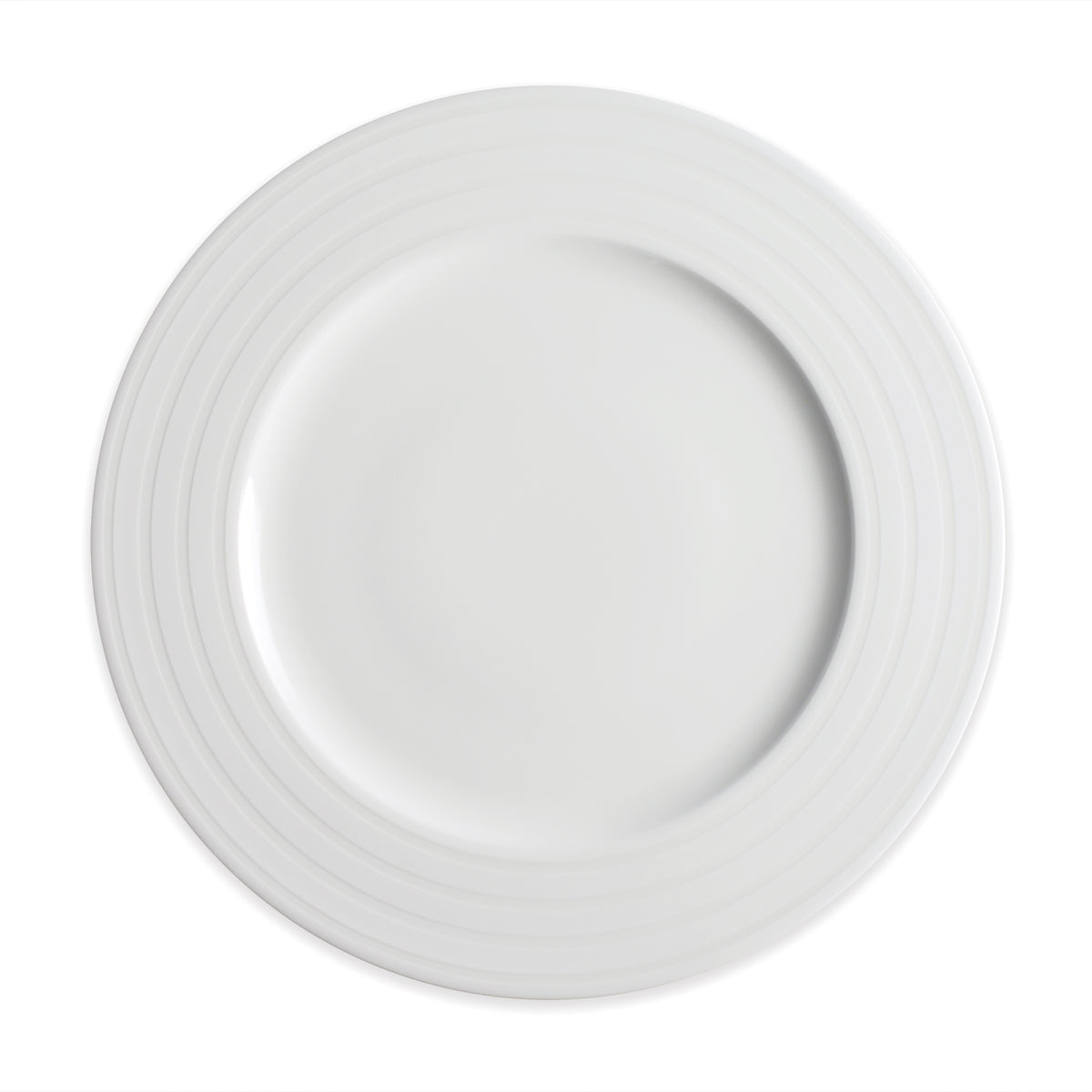 White, round ceramic dinner plate featuring a raised rim and subtle concentric ridges; this timeless dinnerware captures elegance reminiscent of the Caskata Artisanal Home Cambridge Stripe Rimmed Dinner Plate.