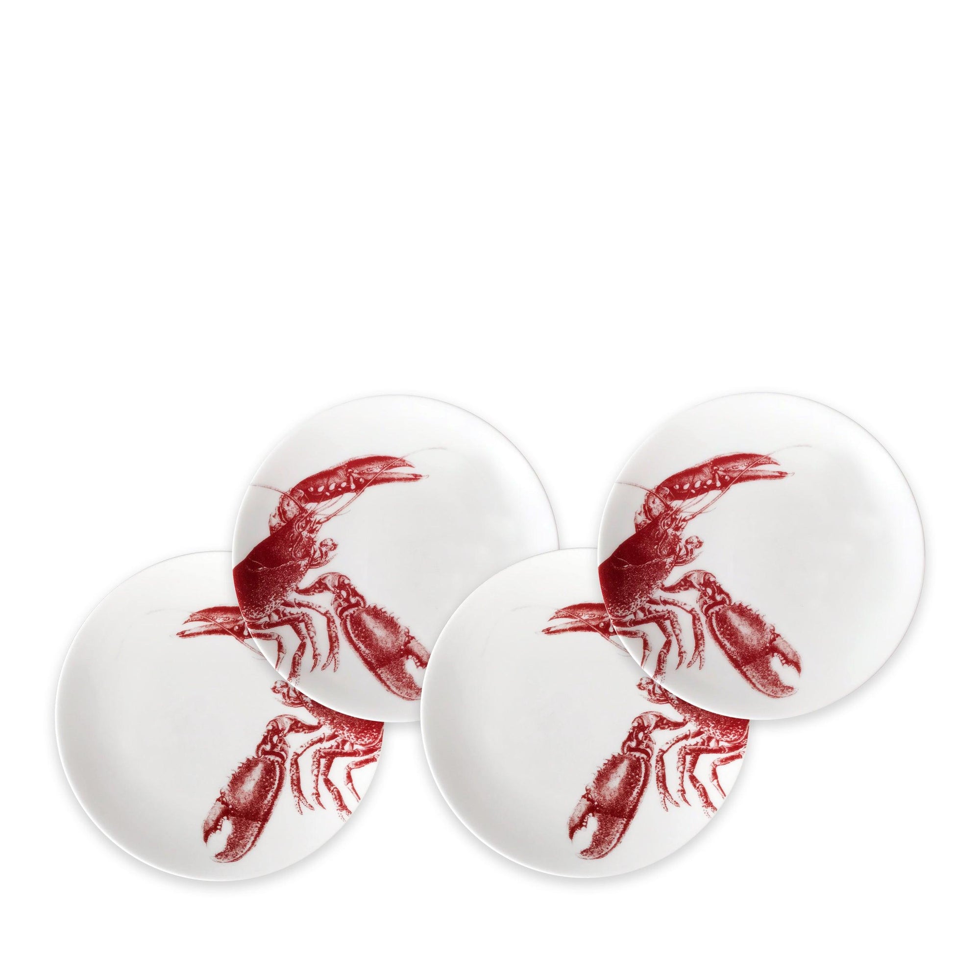 Four heirloom-quality Lobster Red Small Plates from Caskata Artisanal Home, each featuring a red lobster illustration on one side, perfect for adding a touch of seaside style to your dinnerware collection.