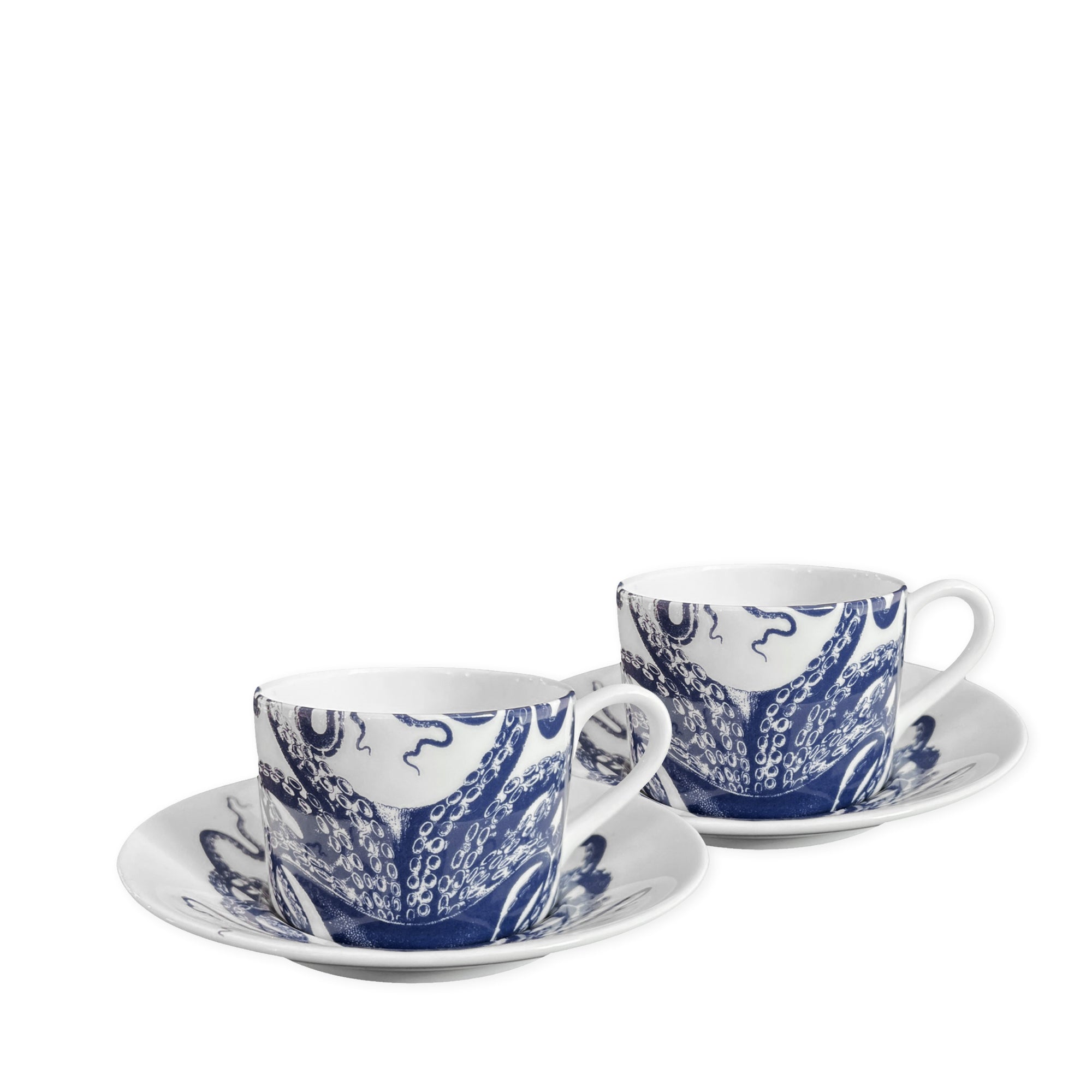 Two white ceramic teacups and saucers featuring charming blue octopus designs, crafted from bone china and dishwasher safe are known as the Lucy Cups & Saucers, Set of 2 by Caskata.