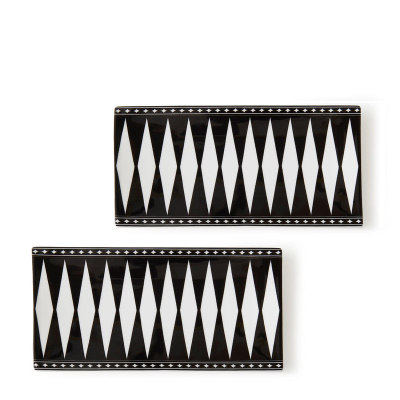 The Marrakech Petite Trays Set of 2 by Caskata includes rectangular bone china trays featuring a black and white diamond pattern with star borders, inspired by Moroccan design elements.