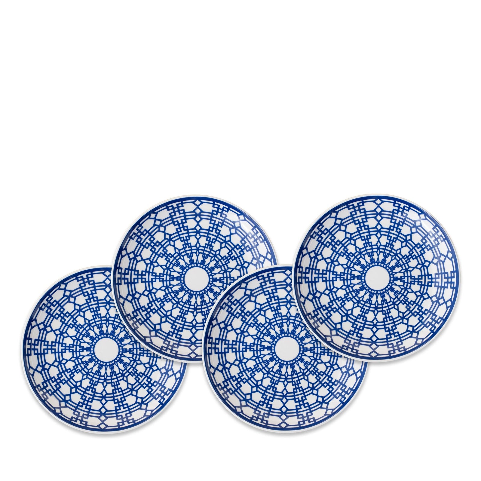 Four blue and white ceramic plates with intricate, interlocking lattice patterns, arranged overlapping each other in a fan shape. Perfect for any setting, these Newport Small Plates by Caskata Artisanal Home are crafted from premium porcelain inspired by the Newport Garden Gate design.