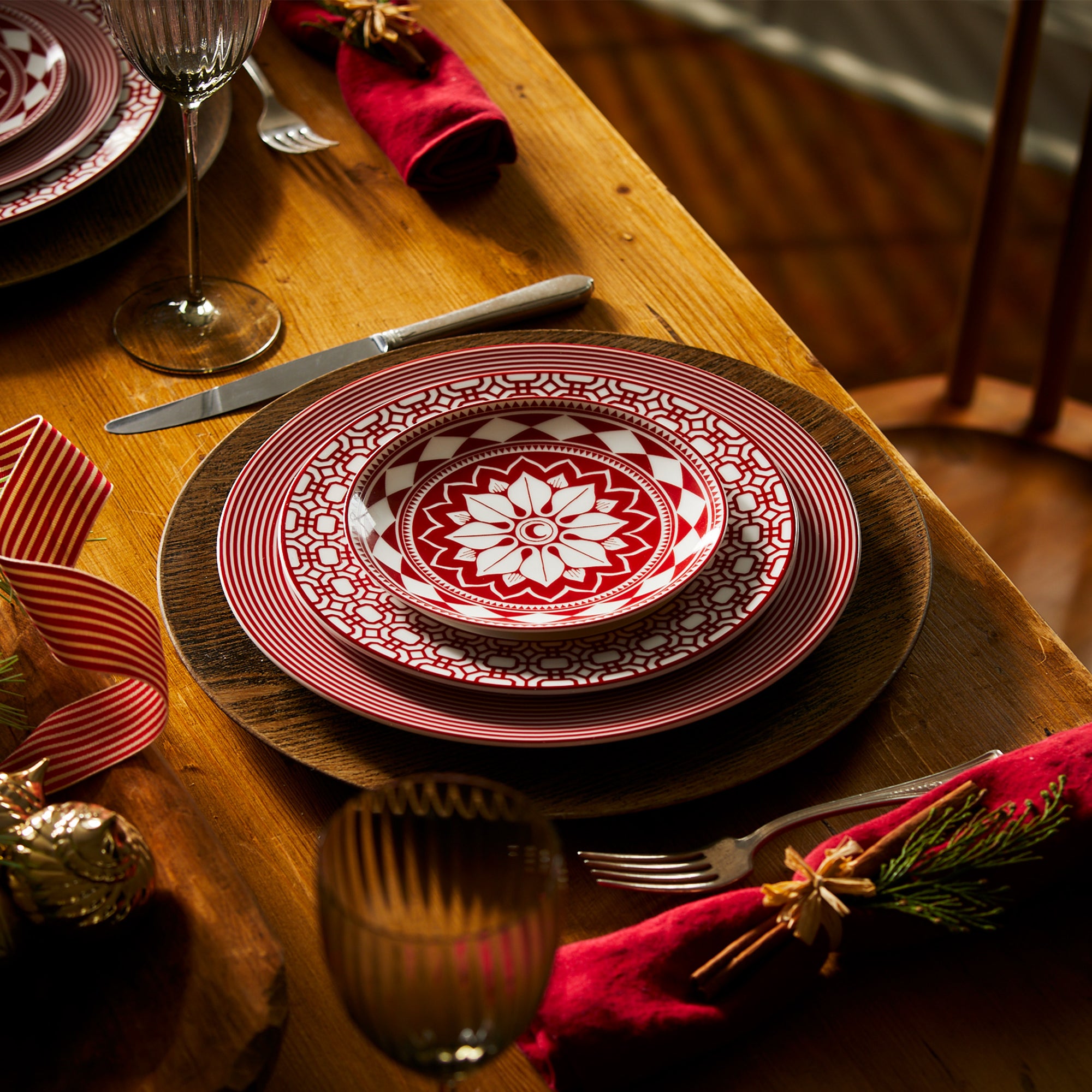 A Newport Garden Gate Crimson Rimmed Salad Plate, part of the Caskata Artisanal Home collection, crafted from premium porcelain.